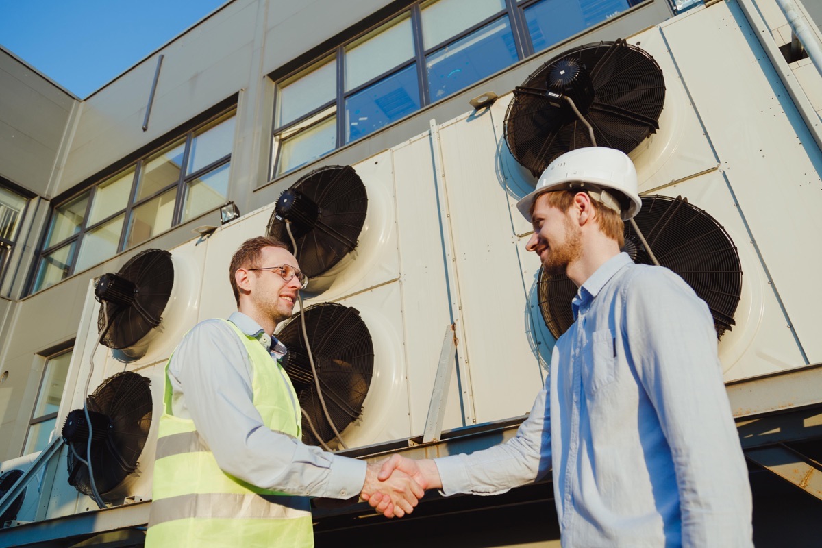 HVAC contractor meeting with a customer